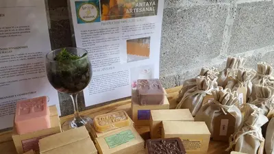 a glass of wine sitting next to boxes of food at OutBox Inn in Monteverde Costa Rica