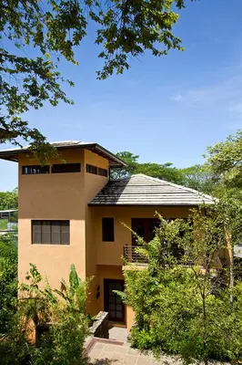 a large building with a roof on top of it at Jet Luxury at Langosta Beach Resort & Villas in Tamarindo
