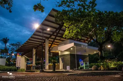 a building at night with the lights on at Hotel Punta Leona in Jacó