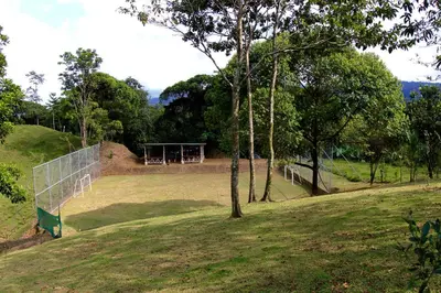 a soccer field with a net and a goal at Epic Adventure Lodge in San Miguel
