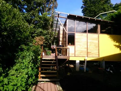 a house with a staircase leading up to it at Casa Higueron in Monteverde Costa Rica