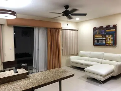 a living room with a white couch and a ceiling fan at LOFTSCACAO APARTMENTS, Villas Cacao, near to Playa Bonita Limón in Puerto Limón