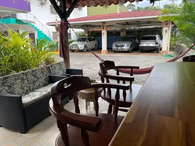 a table and chairs and a couch on a patio at LOFTSCACAO APARTMENTS, Villas Cacao, near to Playa Bonita Limón in Puerto Limón