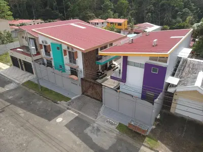 an overhead view of a house with a red roof at LOFTSCACAO APARTMENTS, Villas Cacao, near to Playa Bonita Limón in Puerto Limón