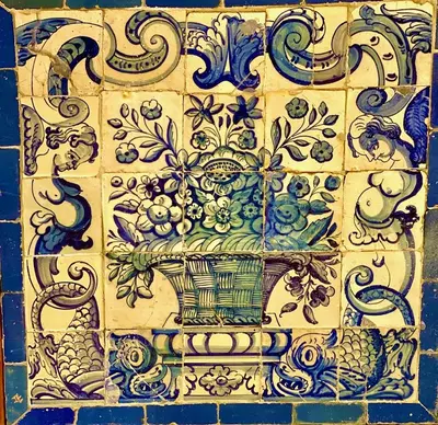a blue and white tile wall with a vase on it at Magic Mountain Views Villa in Atenas