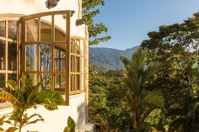 a window with a view of the mountains at El Castillo Luxury Boutique Hotel- in Ojochal