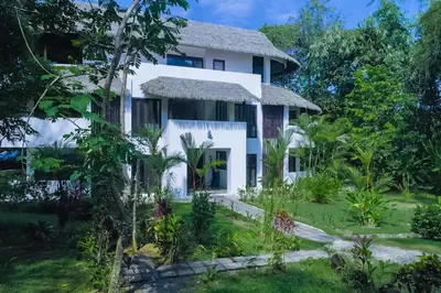 a view of the house from the garden at Makara Suite Mariposa Ground Floor in Uvita