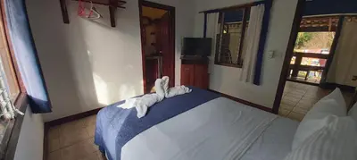 a bedroom with a bed with towels on it at Massai Apartments in Playa Flamingo