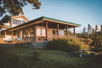 a large house with a large porch at Senda Monteverde Hotel Member of the Cayuga Collection in Monteverde Costa Rica
