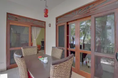 a dining room with a table and chairs at Bahia Azul 7A in Jacó