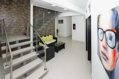 a hallway with a staircase in a building at Hotel Milan Costa Rica in San José
