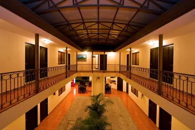 an empty hallway of a building with a ceiling at Hotel El Cerro in Liberia