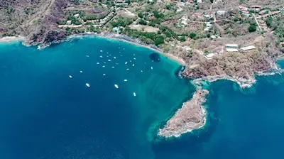 an aerial view of a island with boats in the water at Hotel Ocotal Bed & Breakfast in Ocotal