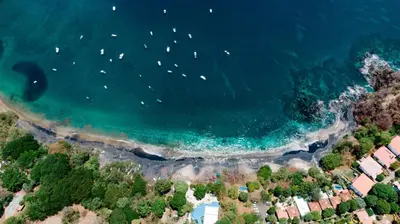 an aerial view of a beach with boats in the water at Hotel Ocotal Bed & Breakfast in Ocotal