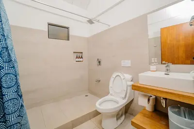 a bathroom with a toilet and a sink at Hotel Ocotal Bed & Breakfast in Ocotal