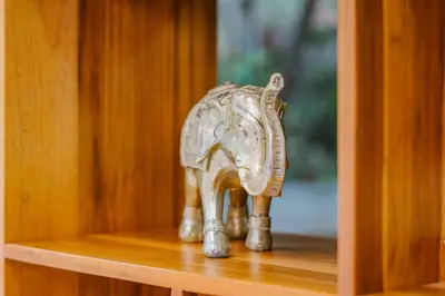a figurine of an elephant sitting on a shelf at Hotel Ocotal Bed & Breakfast in Ocotal