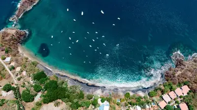 an aerial view of a beach with boats in the water at Hotel Ocotal Bed & Breakfast in Ocotal