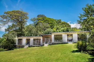 a large yard in front of a house at YerbaBuena Lodge in Monteverde Costa Rica