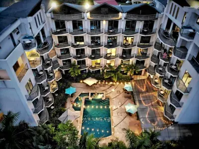 an aerial view of a hotel with a swimming pool at PACIFIC SUITES Boutique Hotel and Bistro in Jacó