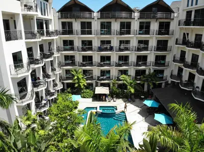 an aerial view of the courtyard of a hotel with a swimming pool at PACIFIC SUITES Boutique Hotel and Bistro in Jacó