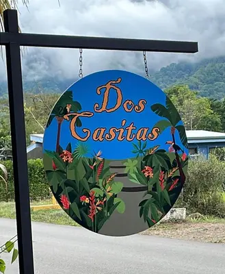 a sign for a dog cafe at Dos Casitas in Ojochal