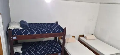 a small room with two bunk beds in it at Mi Casa Tica in Monteverde Costa Rica