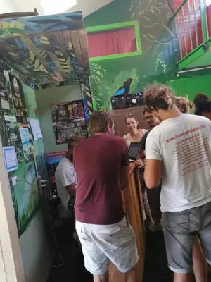 a group of people standing in a barber shop at Mi Casa Tica in Monteverde Costa Rica
