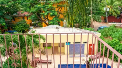 a building with a gate in front of it at LC18 Cometa18 Center of Tamarindo 2bed 3bath in Tamarindo