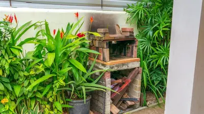 a bird house in a garden with plants at CWC Casa Wasabi 1bedroom 1bathroom in Tamarindo