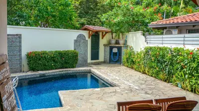 a swimming pool in the backyard of a house at CWC Casa Wasabi 1bedroom 1bathroom in Tamarindo