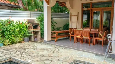 a patio with a table and chairs on a house at CW2 Casa Wasabi 2bed+1bath in Tamarindo