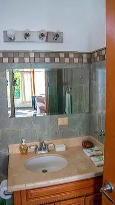 a bathroom with a sink and a mirror at CW2 Casa Wasabi 2bed+1bath in Tamarindo