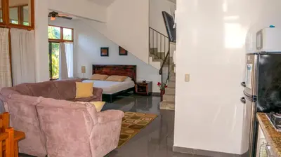 a living room with a couch and a bed at CW2 Casa Wasabi 2bed+1bath in Tamarindo