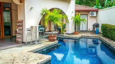 a swimming pool in front of a house at CW3 Casa Wasabi 3bed+3bath in Tamarindo