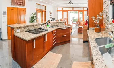 a kitchen with a sink and a counter top at CW3 Casa Wasabi 3bed+3bath in Tamarindo