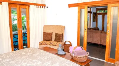 a living room with a couch and a chair at CW3 Casa Wasabi 3bed+3bath in Tamarindo