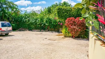 a car parked in the driveway of a house at LC17 La Cometa Center of Tamarindo 2bed+2.5bath in Tamarindo