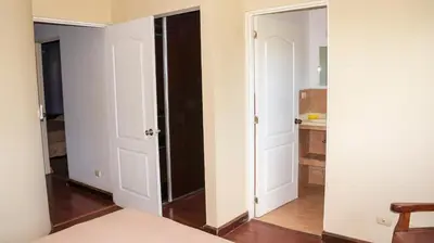 a bedroom with two closets and a door in a room at LC17 La Cometa Center of Tamarindo 2bed+2.5bath in Tamarindo