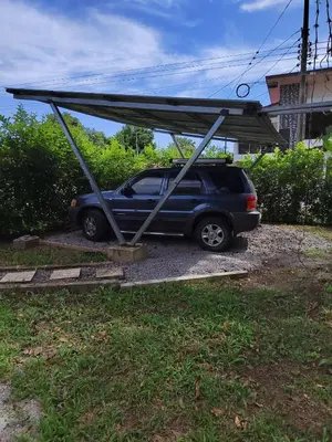 a car parked with a cover on top of it at Salamandra Costa Rica in Jiménez