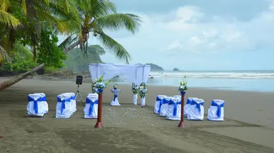 a set up for a wedding on the beach at Hotel Villas Rio Mar in Dominical