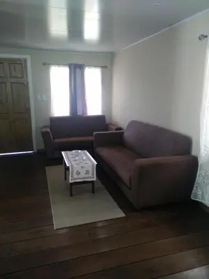 a living room with a couch and a table at Casa Chayito in Santa María