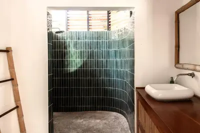 a bathroom with a shower and a sink at Outsite Santa Teresa Playa in Santa Teresa Beach