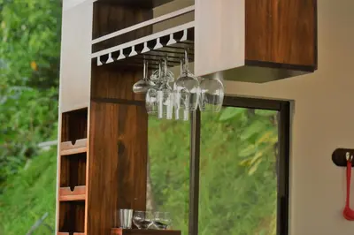 a chandelier hanging over a table in front of a window at Casa Federico in Quepos