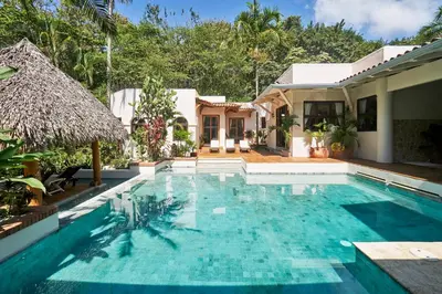 a swimming pool in the backyard of a villa at Paradise Beach Lodge in Mal País