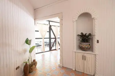a room with a hallway with a plant in it at Paradise Beach Lodge in Mal País