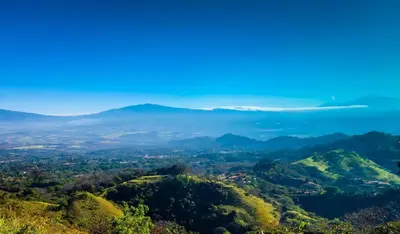 a view of the hills from the top of a mountain at Magic Mountain Views Studio in Atenas