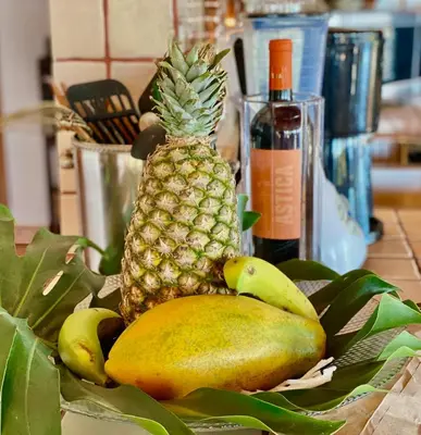 a bunch of pineapple and bananas on a table at Magic Mountain Views Studio in Atenas