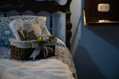 a basket of flowers sitting on a bed at Alice y Juancito Boutique Hotel in Alajuela City