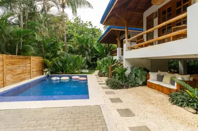 a swimming pool in the backyard of a villa at Blue Surf Sanctuary in Santa Teresa Beach
