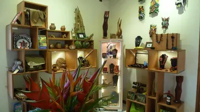 a room with shelves of vases and other items at Tacacori EcoLodge in Alajuela City